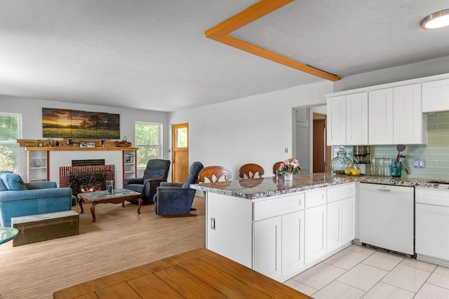 2163 Gracey Ln, Fallbrook, CA 92028 - kitchen featuring dishwasher, white cabinetry, light stone countertops, and a fireplace