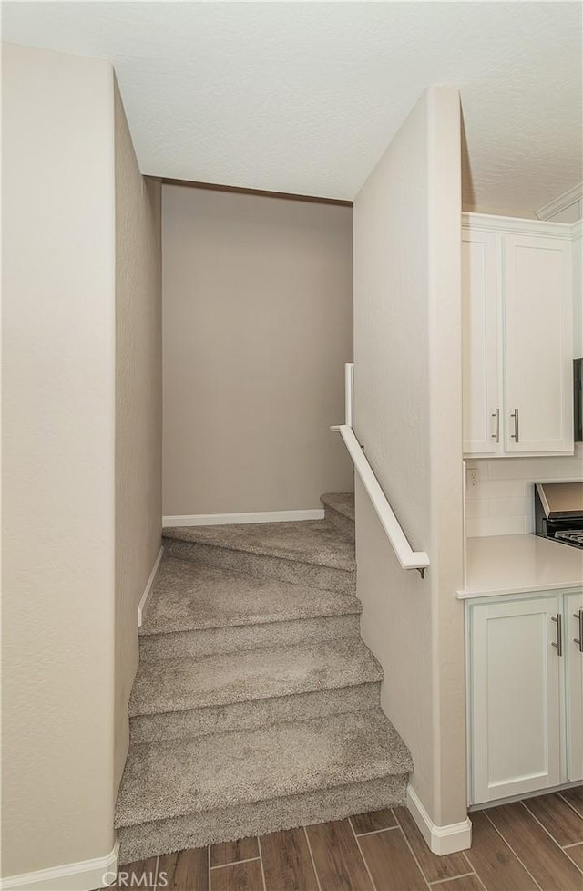 1123 Vanguard Way W, Madera, CA 93636 - staircase featuring wood finished floors and baseboards