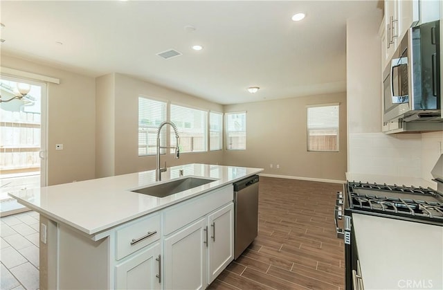 1123 Vanguard Way W, Madera, CA 93636 - kitchen with a sink, stainless steel appliances, baseboards, healthy amount of natural light, and recessed lighting