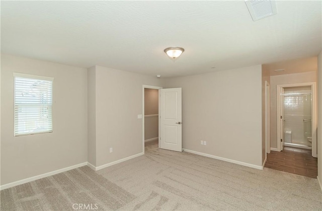 1123 Vanguard Way W, Madera, CA 93636 - unfurnished bedroom with carpet, baseboards, and a spacious closet