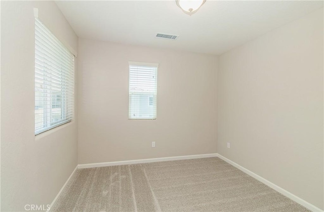 1123 Vanguard Way W, Madera, CA 93636 - carpeted empty room featuring plenty of natural light and baseboards