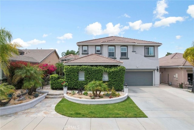 32840 Northshire Cir, Temecula, CA 92592 - mediterranean / spanish-style home with stucco siding, a tiled roof, a garage, and driveway