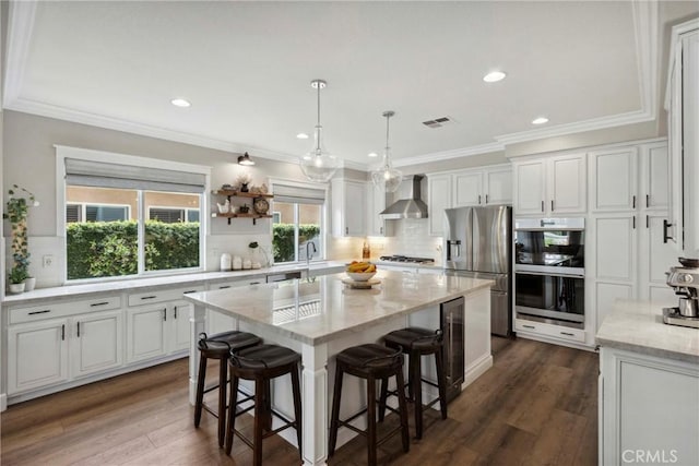 32840 Northshire Cir, Temecula, CA 92592 - kitchen featuring appliances with stainless steel finishes, white cabinetry, decorative backsplash, recessed lighting, and a kitchen island