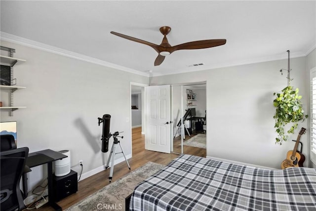 32840 Northshire Cir, Temecula, CA 92592 - bedroom featuring wood finished floors, crown molding, a ceiling fan, and a closet