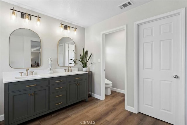 32840 Northshire Cir, Temecula, CA 92592 - bathroom featuring double vanity and wood finished floors