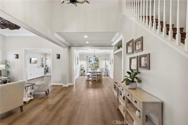 32840 Northshire Cir, Temecula, CA 92592 - foyer entrance featuring crown molding, wood finished floors, a towering ceiling, and recessed lighting
