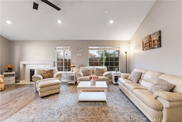 23770 Waterleaf Cir, Moreno Valley, CA 92557 - living room with vaulted ceiling, ceiling fan, a fireplace, wood finished floors, and recessed lighting