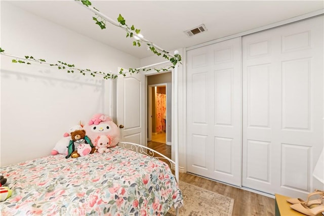 23770 Waterleaf Cir, Moreno Valley, CA 92557 - bedroom with light wood-style floors and a closet