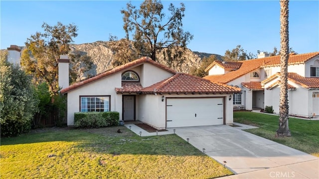 23770 Waterleaf Cir, Moreno Valley, CA 92557 - mediterranean / spanish house featuring a chimney, a garage, stucco siding, concrete driveway, and a front yard
