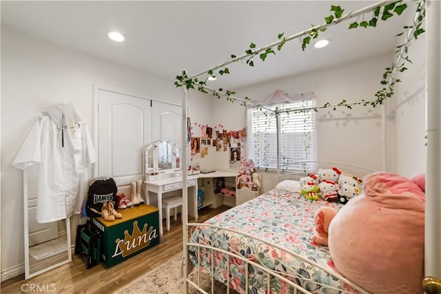 23770 Waterleaf Cir, Moreno Valley, CA 92557 - bedroom with wood finished floors, a closet, and recessed lighting