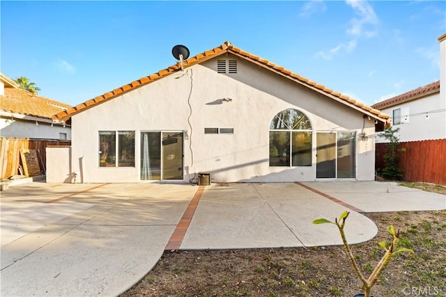 23770 Waterleaf Cir, Moreno Valley, CA 92557 - back of property with fence, stucco siding, a tiled roof, and a patio area