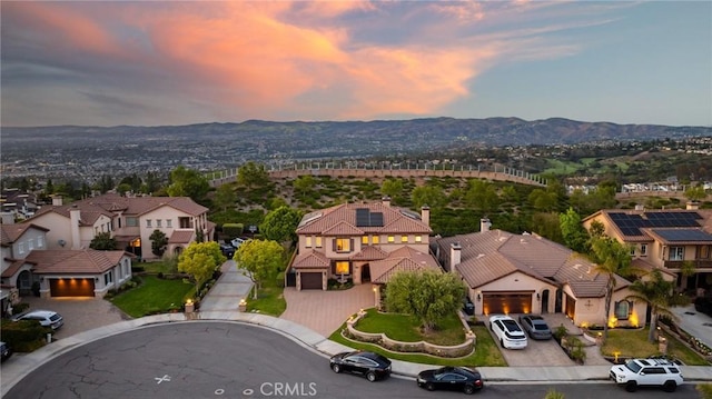 2583 N Skytop Ct, Orange, CA 92867 - aerial view at dusk of a mountain view and a residential view