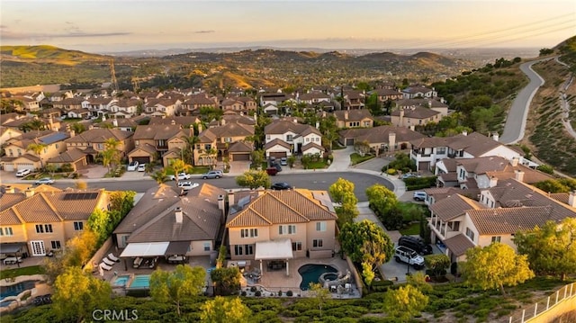 2583 N Skytop Ct, Orange, CA 92867 - aerial view at dusk of a residential view and a mountain view