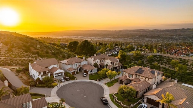 2583 N Skytop Ct, Orange, CA 92867 - aerial view at dusk of a residential view and a mountain view