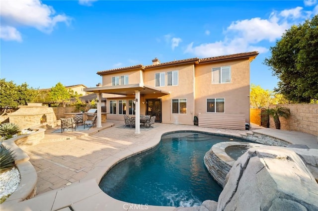 2583 N Skytop Ct, Orange, CA 92867 - rear view of house featuring stucco siding, a chimney, a fenced backyard, and a patio