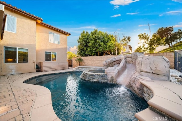 2583 N Skytop Ct, Orange, CA 92867 - view of swimming pool with a fenced backyard and a pool with connected hot tub