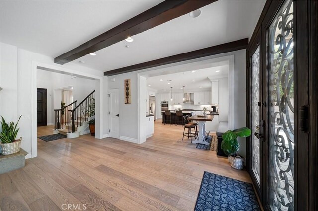 2583 N Skytop Ct, Orange, CA 92867 - foyer with stairs, beamed ceiling, light wood finished floors, baseboards, and recessed lighting