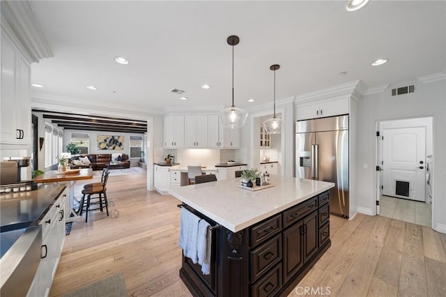 2583 N Skytop Ct, Orange, CA 92867 - kitchen with stainless steel built in refrigerator, white cabinets, crown molding, a center island, and light wood finished floors