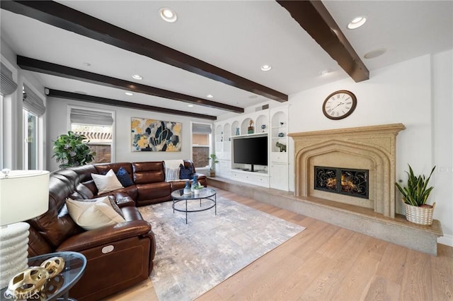 2583 N Skytop Ct, Orange, CA 92867 - living room with wood finished floors, healthy amount of natural light, a fireplace, beam ceiling, and recessed lighting