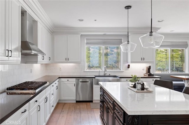 2583 N Skytop Ct, Orange, CA 92867 - kitchen with appliances with stainless steel finishes, a sink, wall chimney range hood, white cabinetry, and recessed lighting