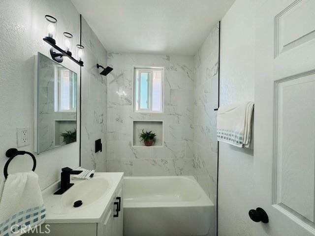623 E Elm St, Ontario, CA 91761 - bathroom featuring vanity and shower / washtub combination