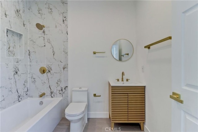 623 E Elm St, Ontario, CA 91761 - bathroom with toilet, vanity, wood finished floors, and bathtub / shower combination