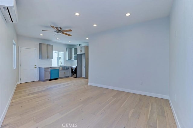 623 E Elm St, Ontario, CA 91761 - unfurnished living room featuring light wood-type flooring, recessed lighting, ceiling fan, a wall unit AC, and baseboards