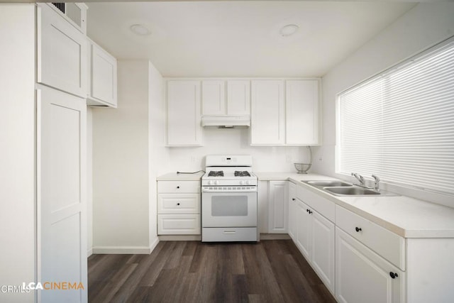 2617 Pinon Spring Cir Unit C, Bakersfield, CA 93309 - kitchen featuring gas range gas stove, a sink, under cabinet range hood, dark wood-type flooring, and white cabinetry
