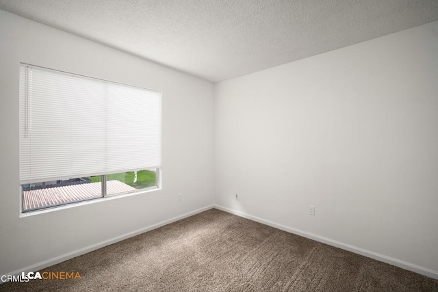 2617 Pinon Spring Cir Unit C, Bakersfield, CA 93309 - carpeted spare room with baseboards and a textured ceiling