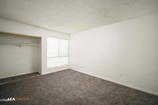 2617 Pinon Spring Cir Unit C, Bakersfield, CA 93309 - unfurnished bedroom with dark carpet, a textured ceiling, baseboards, and a closet
