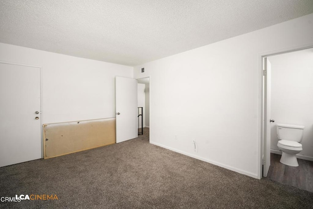2617 Pinon Spring Cir Unit C, Bakersfield, CA 93309 - unfurnished bedroom with carpet, a textured ceiling, and connected bathroom