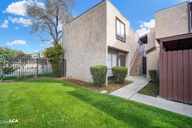 2617 Pinon Spring Cir Unit C, Bakersfield, CA 93309 - view of property exterior featuring stairway and stucco siding