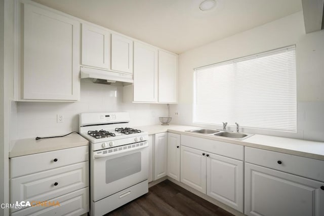 2617 Pinon Spring Cir Unit C, Bakersfield, CA 93309 - kitchen with white gas range oven, under cabinet range hood, a sink, and white cabinets