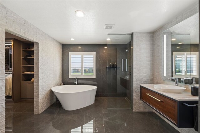 46397 Kohinoor Way, Temecula, CA 92592 - full bath with a walk in shower, a freestanding tub, vanity, a spacious closet, and marble tiled floors