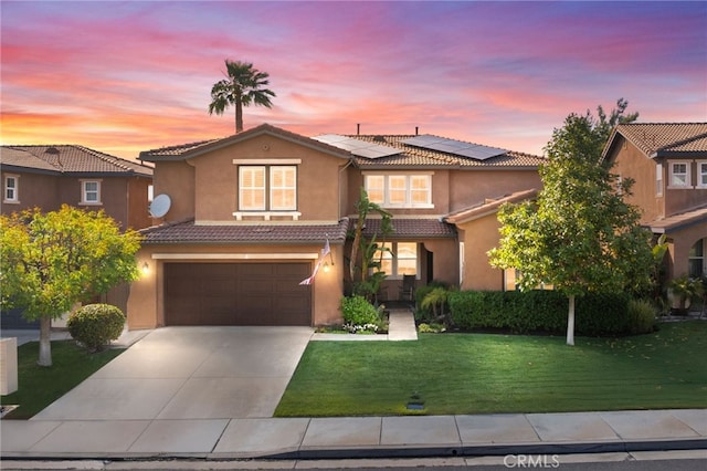 46397 Kohinoor Way, Temecula, CA 92592 - view of front facade featuring a tile roof, stucco siding, a front yard, solar panels, and driveway
