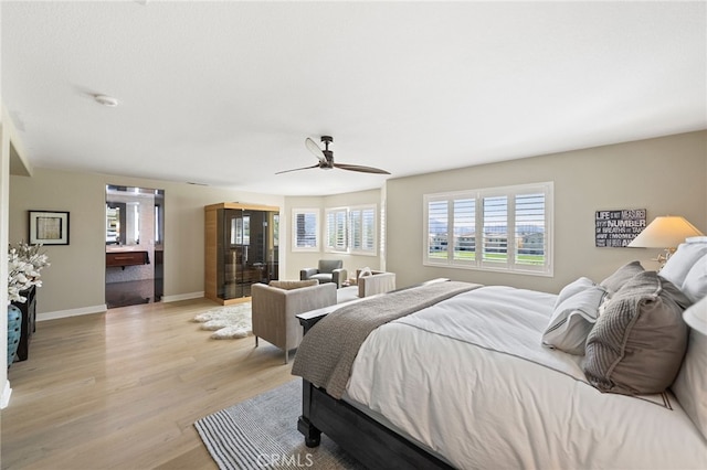 46397 Kohinoor Way, Temecula, CA 92592 - bedroom featuring light wood-style flooring, multiple windows, and ceiling fan