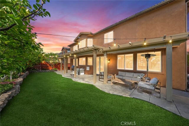 46397 Kohinoor Way, Temecula, CA 92592 - rear view of house featuring outdoor lounge area, stucco siding, a patio area, and a fenced backyard