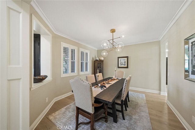 46397 Kohinoor Way, Temecula, CA 92592 - dining room with a chandelier, light wood-type flooring, and crown molding