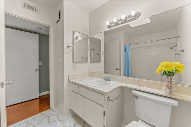 628 Daisy Ave Unit 420, Long Beach, CA 90802 - bathroom featuring vanity, toilet, marble finish floors, baseboards, and curtained shower