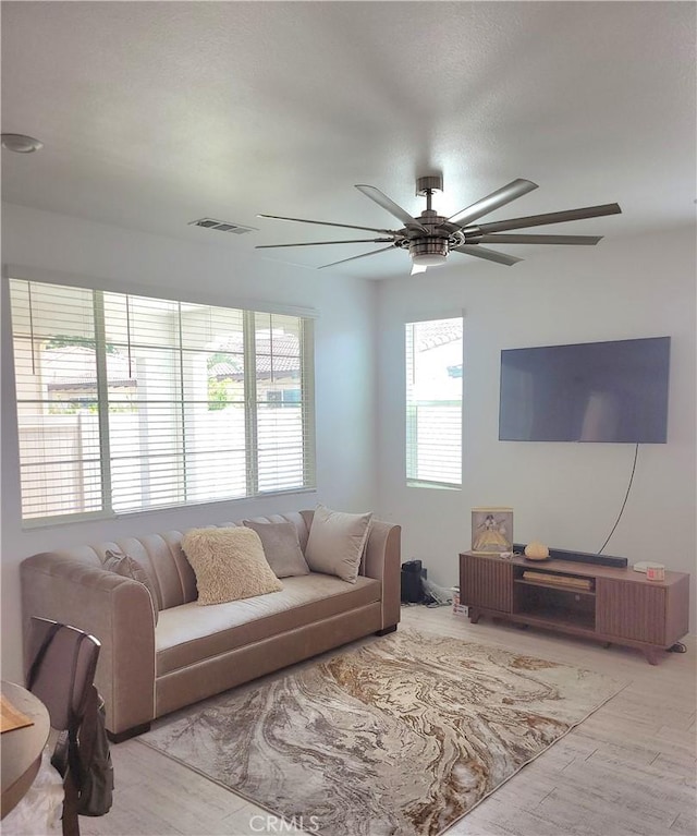 4511 S Luna Privado, Ontario, CA 91761 - living area with plenty of natural light, ceiling fan, and wood finished floors