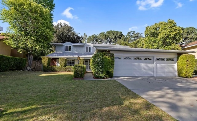 5340 Edgeware Dr, Calabasas, CA 91301 - view of front of house with driveway, a garage, stucco siding, and a front yard