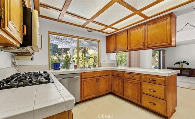 5340 Edgeware Dr, Calabasas, CA 91301 - kitchen featuring gas cooktop, stainless steel dishwasher, tile counters, and brown cabinets