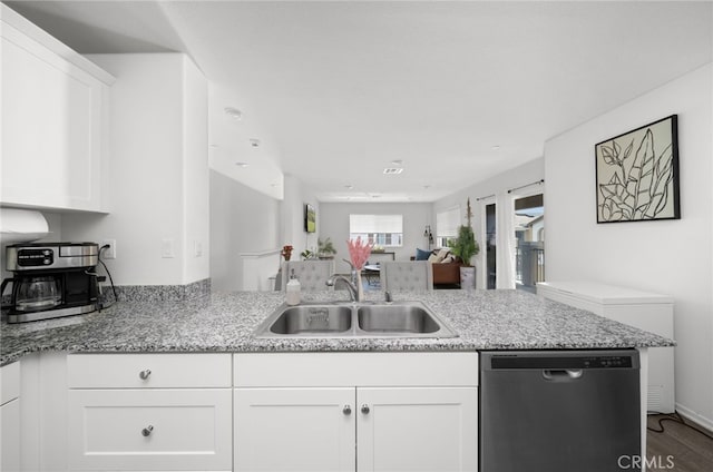 35753 Starling Ave Unit 1901, Murrieta, CA 92563 - kitchen with stainless steel dishwasher, a sink, white cabinets, a peninsula, and light stone counters