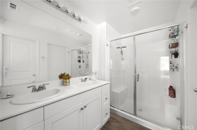 35753 Starling Ave Unit 1901, Murrieta, CA 92563 - full bathroom with a shower stall, wood finished floors, and double vanity
