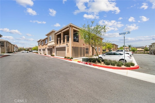 35753 Starling Ave Unit 1901, Murrieta, CA 92563 - view of asphalt road featuring a residential view and curbs