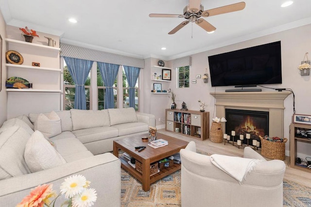 4304 Pacifica Way Unit 2, Oceanside, CA 92056 - living room with crown molding, a ceiling fan, wood finished floors, recessed lighting, and a glass covered fireplace