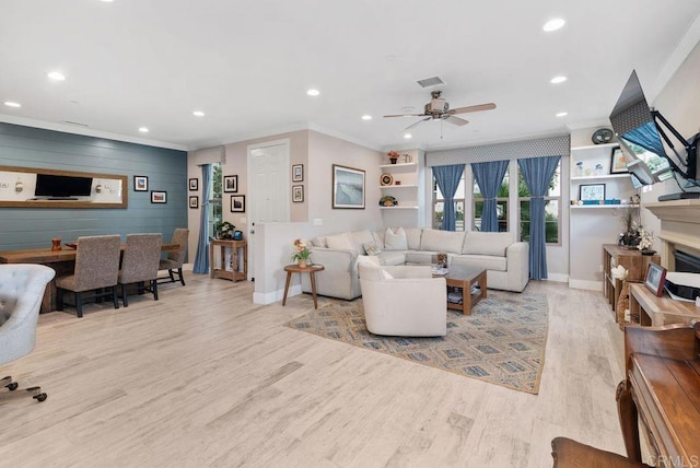 4304 Pacifica Way Unit 2, Oceanside, CA 92056 - living area with ornamental molding, wood finished floors, recessed lighting, ceiling fan, and a fireplace