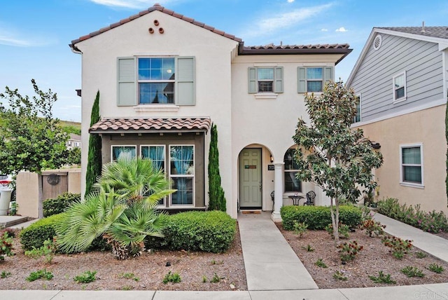4304 Pacifica Way Unit 2, Oceanside, CA 92056 - mediterranean / spanish-style home with a tiled roof and stucco siding