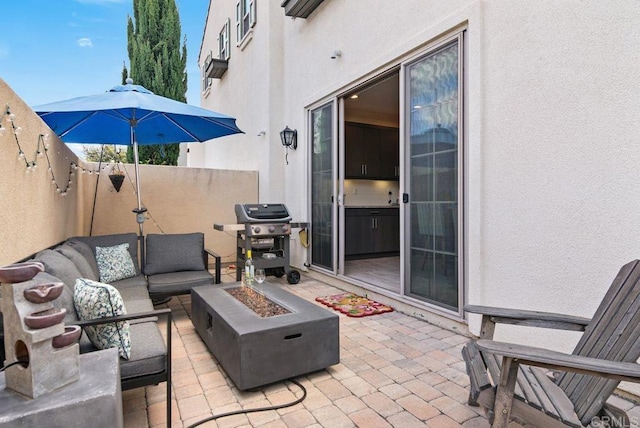 4304 Pacifica Way Unit 2, Oceanside, CA 92056 - fenced backyard with grilling area, an outdoor living space with a fire pit, and a patio