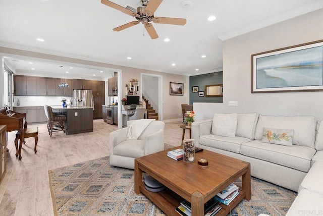 4304 Pacifica Way Unit 2, Oceanside, CA 92056 - living area featuring crown molding, light wood-style floors, ceiling fan, recessed lighting, and stairs